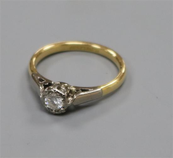 An 18ct gold, platinum and illusion set solitaire diamond ring, size J.